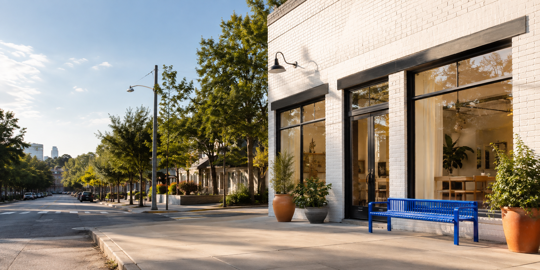Modern community studio exterior in a leafy neighborhood